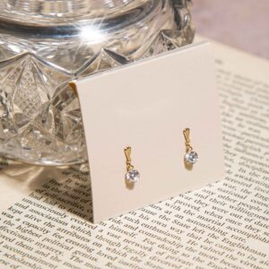 gold 5mm cz drop earrings in 9ct Yellow Gold shown on a display card with bright round stones