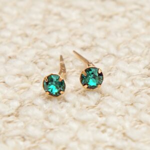 gold blue zircon studs shown as a matching pair with bright blue zircon sparkle